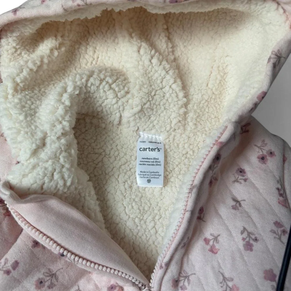 Carter's pink floral snowsuit with hood and fleece lining. Size: newborn 0 m